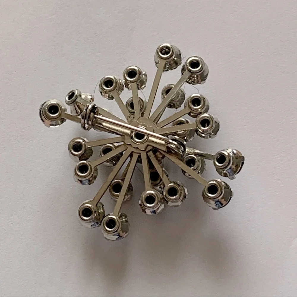 Vintage brooch bundle featuring a snowflake brooch and starburst brooch